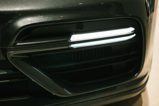 istock The headlight of the new car. 870538368