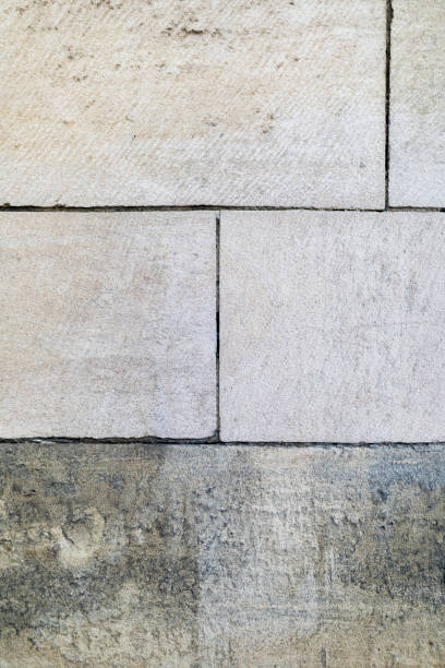 istock Large UK church sandstone building bricks or blocks background texture with a grunge feel 870549146