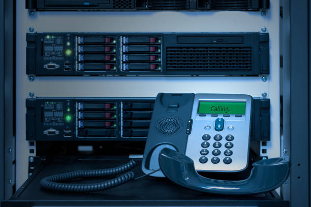 VOIP Phone (IP Phone) in data center room stock photo
