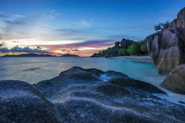 istock romantic sunset in paradise, silver spring cove, the dike, seychelles 21 870551782