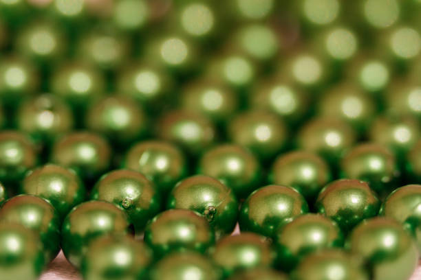 istock Multicolored blanks for beads close-up. Macro photo on a red background 870552508