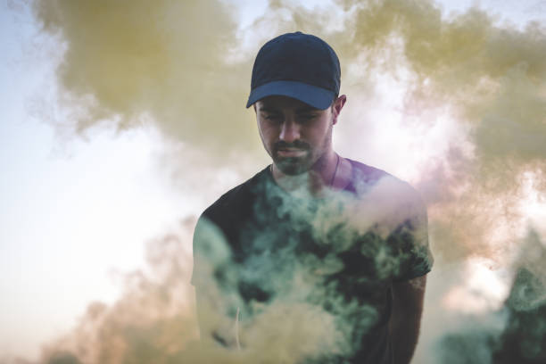 istock Beautiful man in smoke 870565032