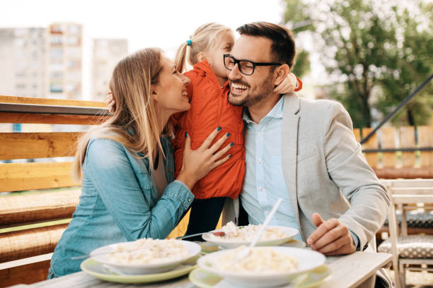 Family enjoying restaurant stock photo