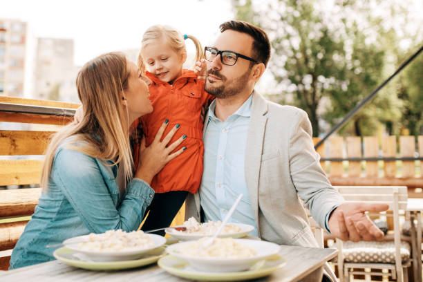 istock Family enjoying restaurant 870571936