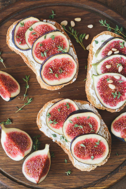 istock Appetizer bruschetta or toast with fresh cheese, figs and honey 870572534