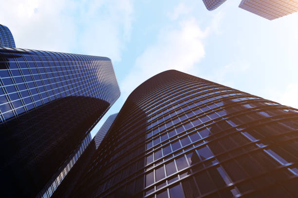 istock 3d rendering Low angle view of skyscrapers. Skyscrapers at sunset looking up perspective. Bottom view of modern skyscrapers in business district in evening light at sunset. Business concept of success industry tech architecture. 870582350