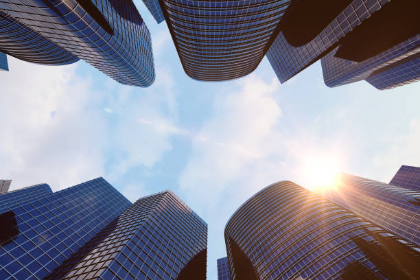 istock 3d rendering Low angle view of skyscrapers. Skyscrapers at sunset looking up perspective. Bottom view of modern skyscrapers in business district in evening light at sunset. Business concept of success industry tech architecture. 870582364