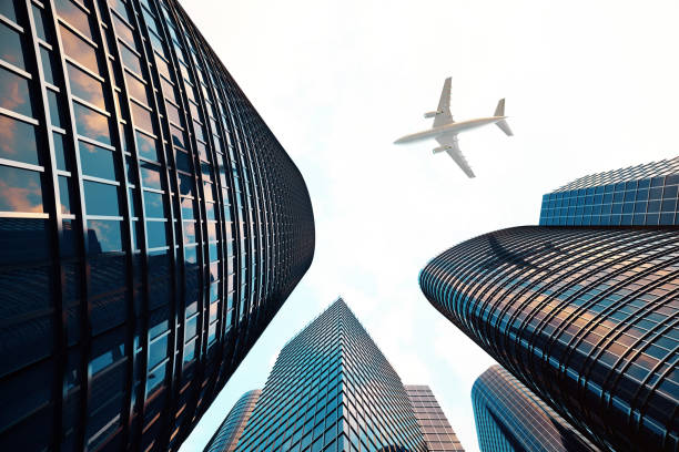 istock 3d rendering Low angle view of skyscrapers. Skyscrapers at sunset looking up perspective. Bottom view of modern skyscrapers in business district in evening light at sunset. Business concept of success industry tech architecture. 870582400