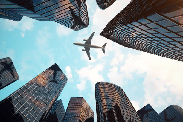 istock 3d rendering Low angle view of skyscrapers. Skyscrapers at sunset looking up perspective. Bottom view of modern skyscrapers in business district in evening light at sunset. Business concept of success industry tech architecture. 870582420