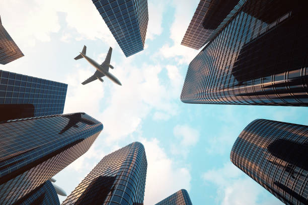 istock 3d rendering Low angle view of skyscrapers. Skyscrapers at sunset looking up perspective. Bottom view of modern skyscrapers in business district in evening light at sunset. Business concept of success industry tech architecture. 870582432