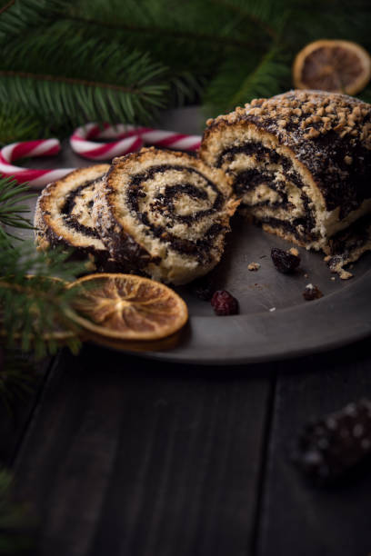 istock Christmas poppy seed cake on wooden background 870588104