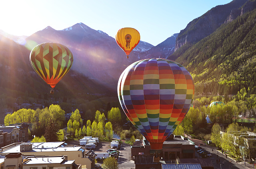 Balloon festival in Telluride Hot Air balloons flying over Town in the morning,Telluride, Colorado, USA, 06.01.2013
