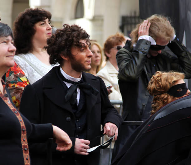 Actor in image of the great Russian poet, Pushkin at the annual street celebration of birthday of another great writer, Feodor Dostoevsky St. PETERSBURG, RUSSIA - JUL 5, 2014: Actor Iliya Del in image of the great Russian poet, Pushkin at the annual street celebration of birthday of another great writer, Feodor Dostoevsky tragicomedy stock pictures, royalty-free photos & images