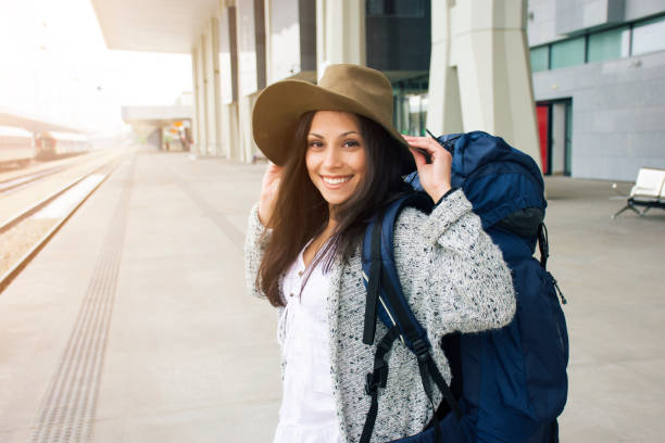 istock Happy woman in a station 870592702