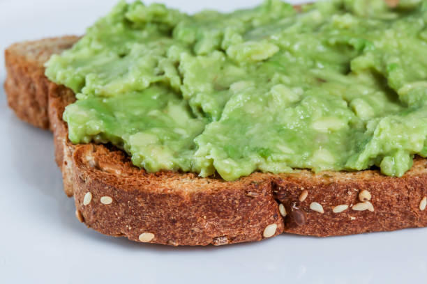 istock Toast with avocado close up 870595702
