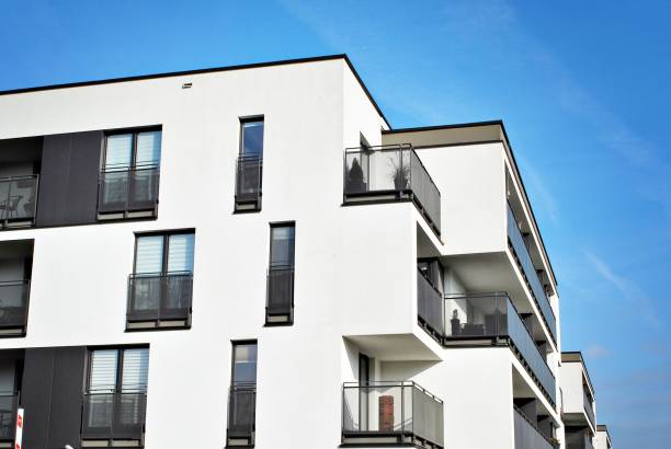 istock Modern apartment buildings on a sunny day with a blue sky 870598588