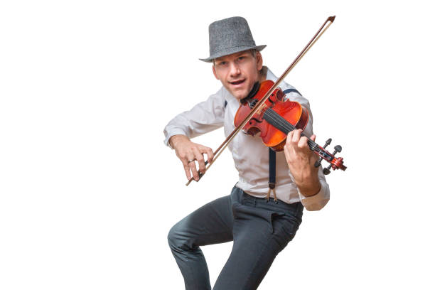 Man with hat plays violin, dances and sings isolated on white