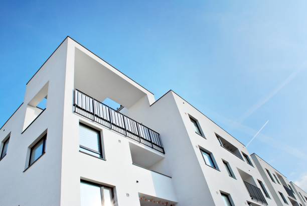 istock Modern apartment buildings on a sunny day with a blue sky 870599224