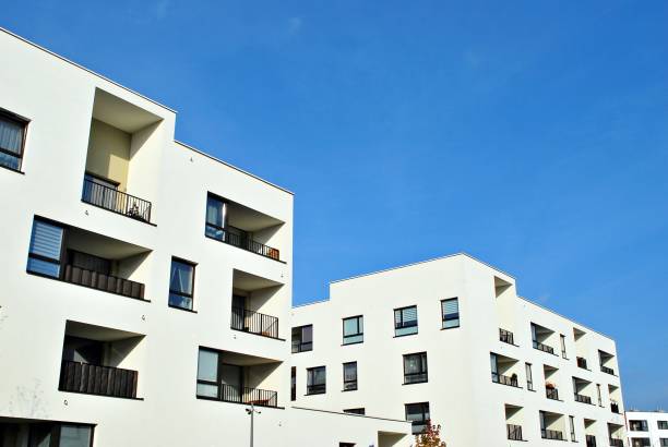 istock Modern apartment buildings on a sunny day with a blue sky 870599522
