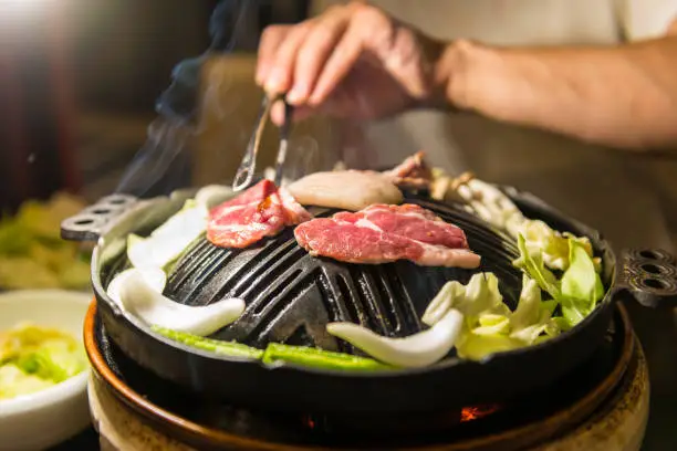 Close-up of Genghis Khan, popular Japanese dishes, also known as jingisukan. This is a barbecued lamb dish which was a popular dish among Mongolian soldiers in the past. It is popular in Hakodate and Sapporo on Hokkaido, Japan