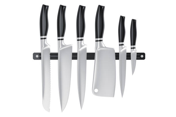 istock Set of kitchen knives on magnetic holder, 3D rendering isolated on white background 870602504