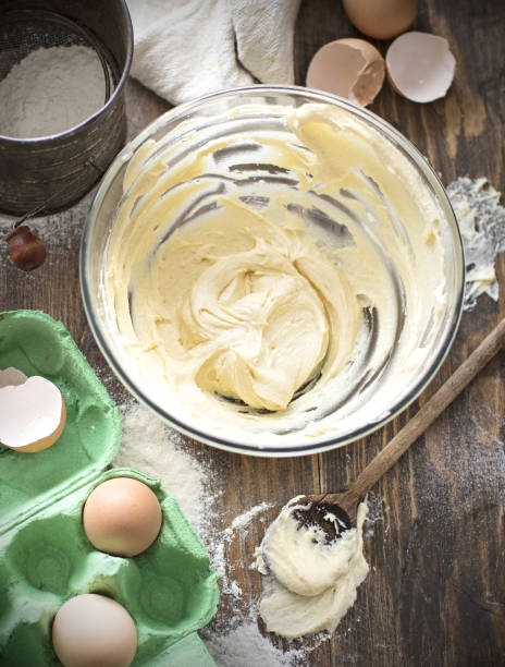 istock Making dough or cream and baking ingredients, eggs, flour, 870605382