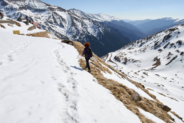 istock Woman hiking into the mountains 870609414
