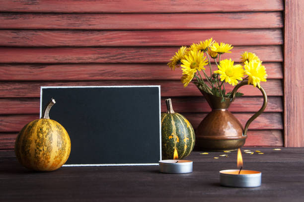 istock Pumpkins,copper jug with yellow chrysanthemums 870619004