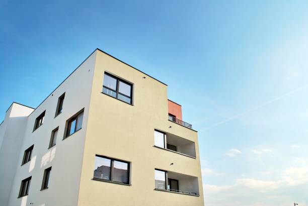 istock Modern apartment buildings on a sunny day with a blue sky 870628716