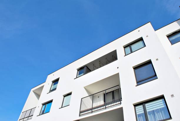 istock Modern apartment buildings on a sunny day with a blue sky 870629046