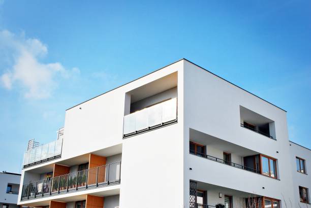 istock Modern apartment buildings on a sunny day with a blue sky 870629098