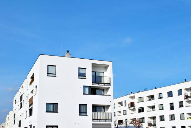 istock Modern apartment buildings on a sunny day with a blue sky 870631186