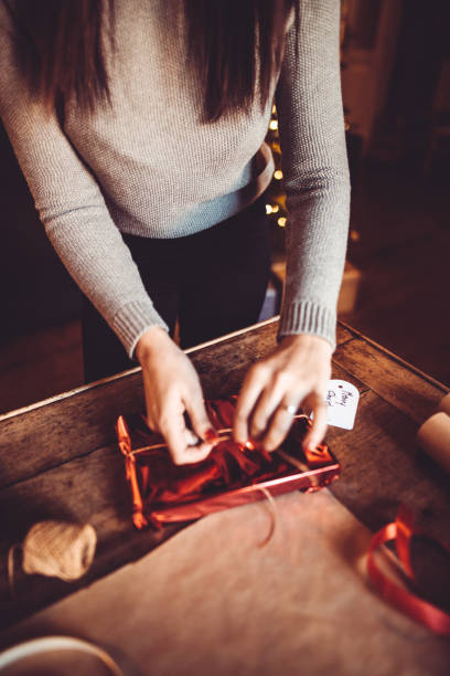 istock woman making the package for the christmas gift 870631370