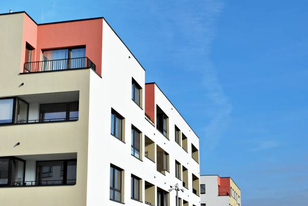 istock Modern apartment buildings on a sunny day with a blue sky 870631454