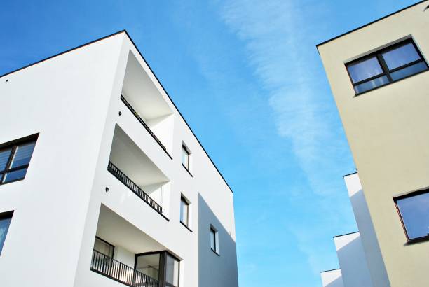 istock Modern apartment buildings on a sunny day with a blue sky 870631488