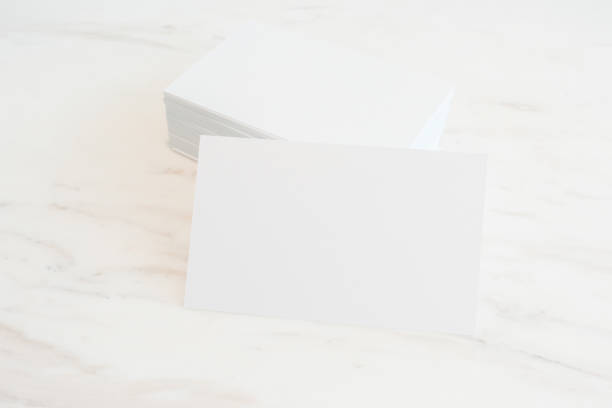 istock Mockup of blank business cards stack on marble table background. Template for ID. For design presentations and portfolios. 870640200