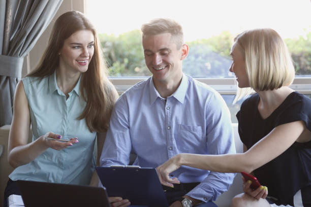 istock Three young business people in a cafe 870640546