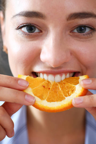 istock Woman portrait holds in her hand a slice 870640966