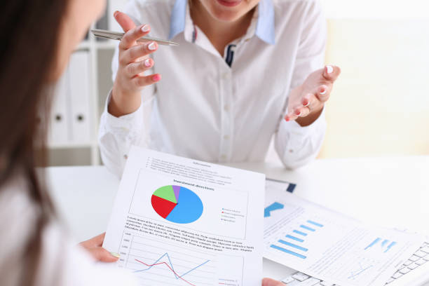 istock Businesswoman holding a silvery pen 870641254