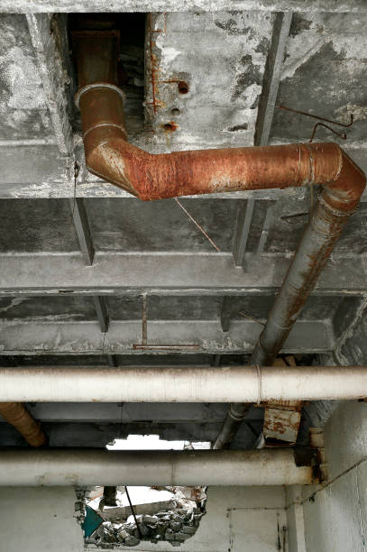 istock Pipe in a ruined factory building 870641680