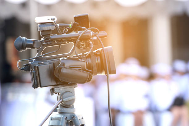 istock Video camera on stand with digital broadcasting to TV and live internet. 870649238