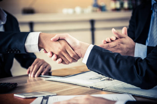 istock business handshake and teamwork for achievement KPI and goal 870654896