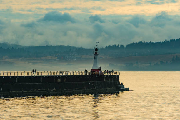 istock Lighthouse with Clouds in Victoria British Columbia Canada 870658670
