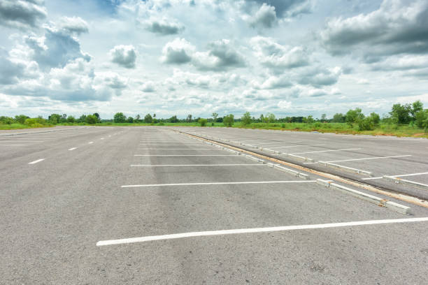 istock Empty parking lot against a beautiful blue sky 870665182