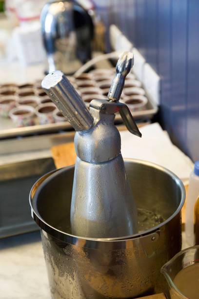 istock Whipping cream dispenser in ice bucket 870684928