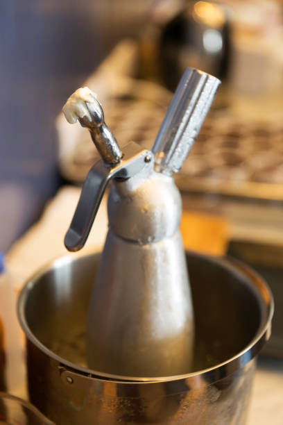 istock Whipping cream dispenser in ice bucket 870684940