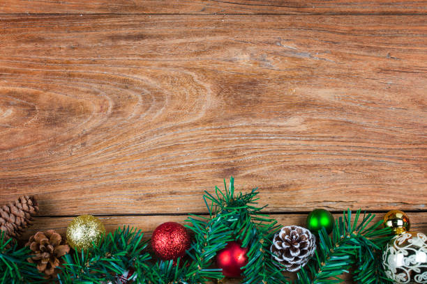 istock Christmas background with decorations and gift boxes on wooden board 870688268