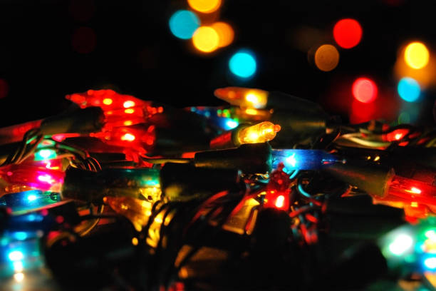 istock Christmas glowing electric garland with lights on a bokeh 870688536