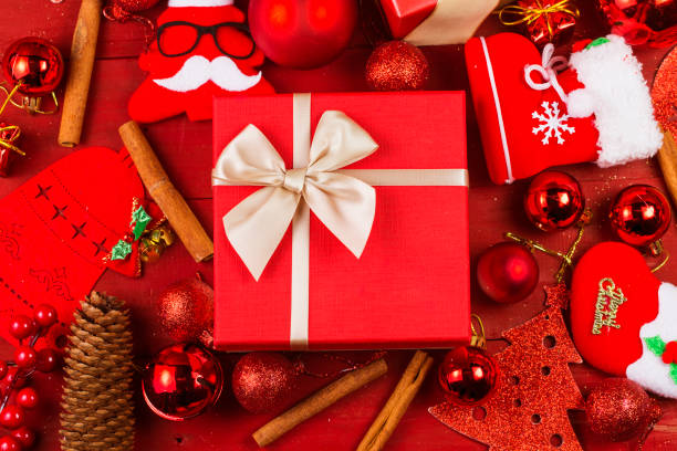 istock Christmas background with decorations and gift boxes on wooden board 870688808