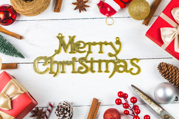 istock Christmas background with decorations and gift boxes on wooden board 870694960